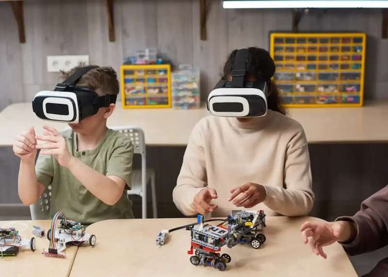 students using AR and VR technology to learn in the classroom